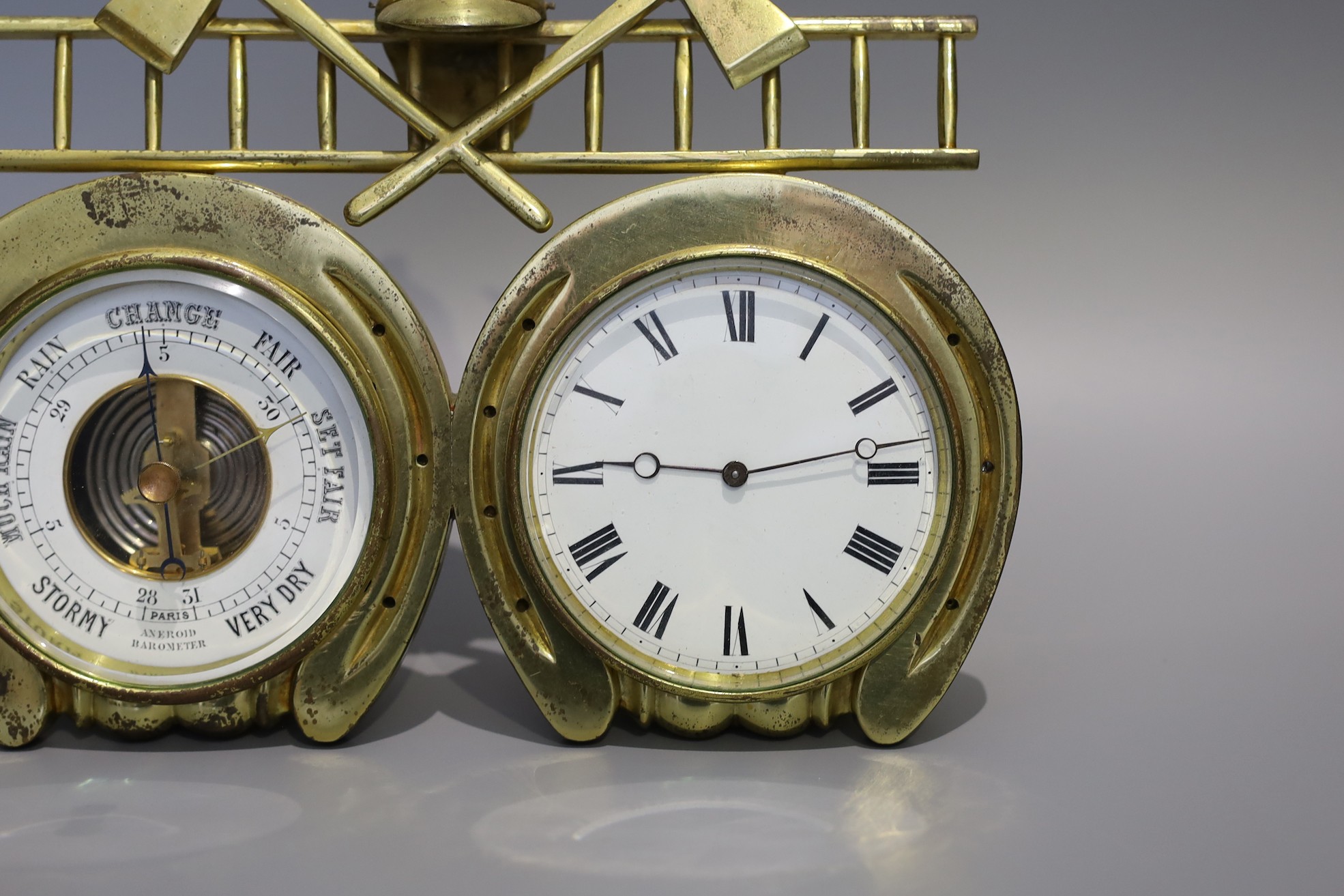 A Victorian brass Fire Service desk timepiece combined aneroid barometer, width 24cm height 19cm